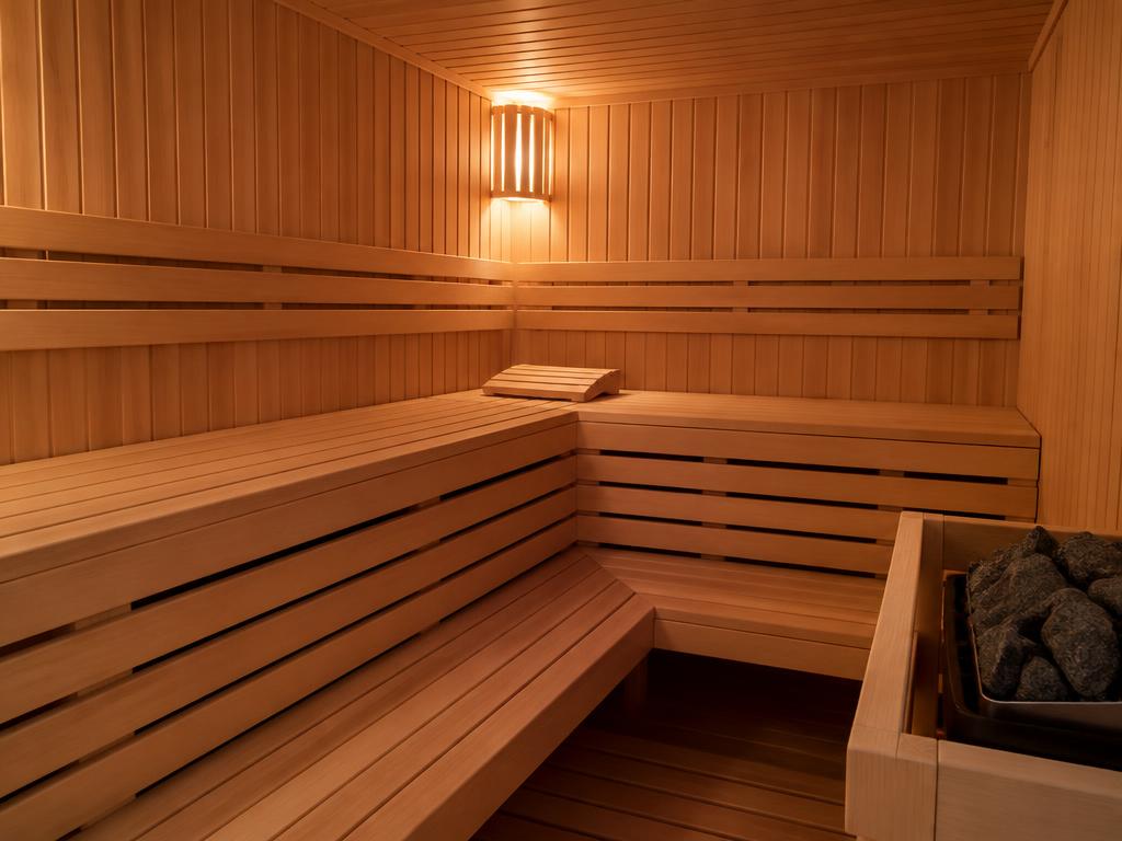 Wooden sauna with tiered benches